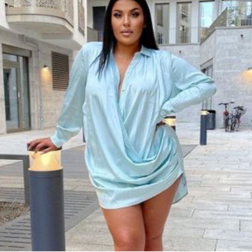 Satin shirt dress featuring button front, draped detail and long sleeves. 1X